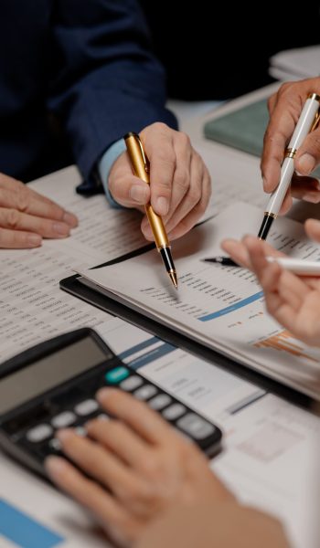 a-group-of-three-businesspeople-are-working-togeth-2026-01-07-01-01-52-utc (1)