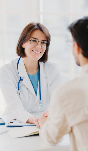 female-doctor-reassures-her-male-patient-hold-han-2026-03-19-09-30-00-utc (1)